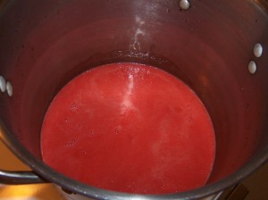 1.5 quarts of fresh strawberry juice in the bottom of the stockpot